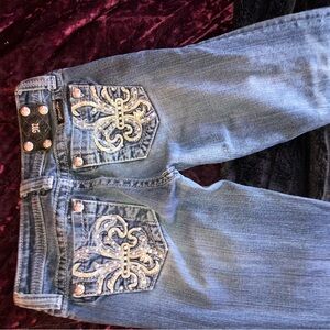 Blue Size 14 miss me jeans with rhinestone crosses on the back pockets